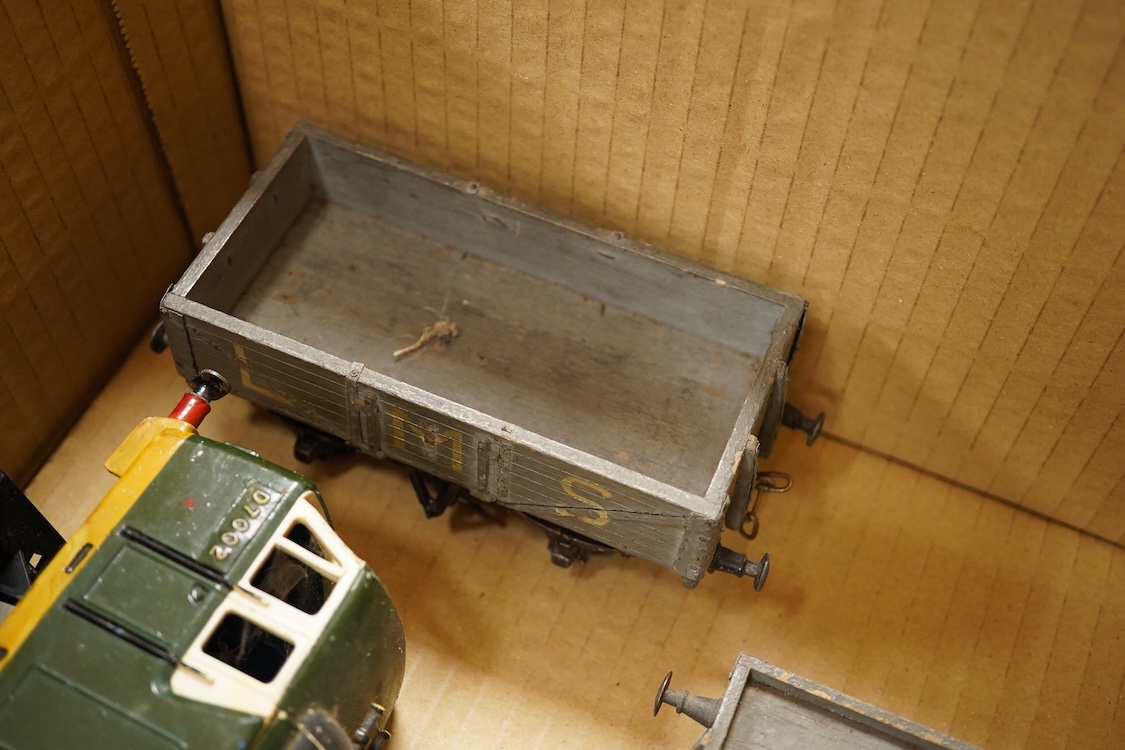 Seven 0 gauge coarse scale LMS and a private owner’s freight wagons, mainly of wood construction, together with the remains of a Tri-ang Big Big Train Class 35 Hymek diesel locomotive (8)